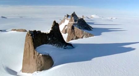 The exposed peaks of vast mountain ranges buried in ice over a mile deep - Planet Earth movie series